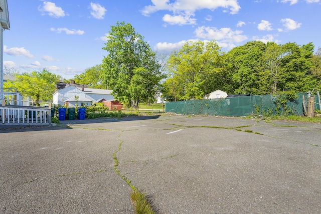 view of car parking featuring fence