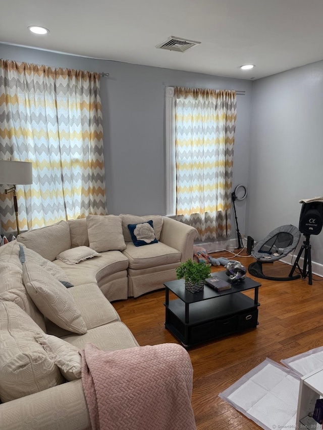 living room featuring wood finished floors and recessed lighting
