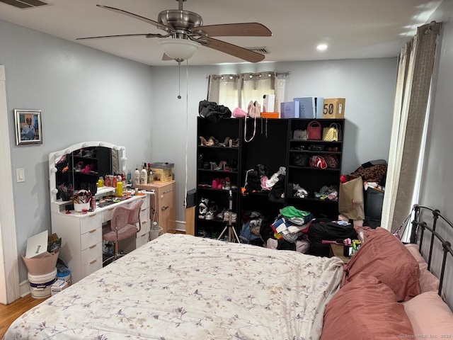 bedroom featuring wood finished floors, recessed lighting, and a ceiling fan