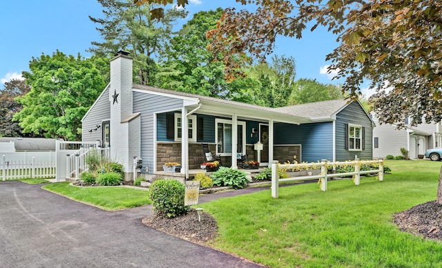 13 Carol St, Enfield, CT 06082 - view of front of home featuring covered porch, a chimney, and stone siding
