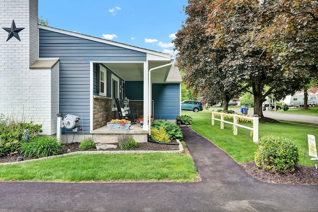13 Carol St, Enfield, CT 06082 - view of side of property featuring a lawn and a porch