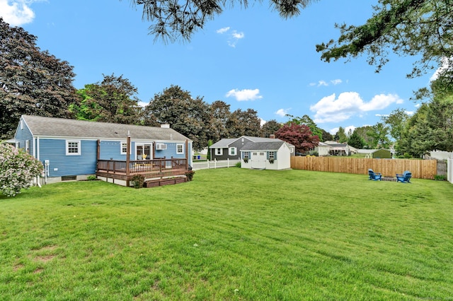 13 Carol St, Enfield, CT 06082 - fenced backyard featuring a deck and a storage unit