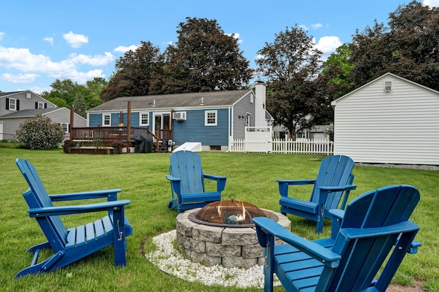 13 Carol St, Enfield, CT 06082 - rear view of house with an outdoor fire pit, a wooden deck, and a chimney