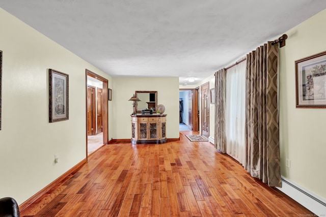 13 Carol St, Enfield, CT 06082 - hall featuring a baseboard radiator and light wood finished floors