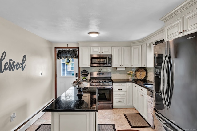 13 Carol St, Enfield, CT 06082 - kitchen with stainless steel appliances, decorative backsplash, light stone finish floors, a kitchen island, and dark stone countertops