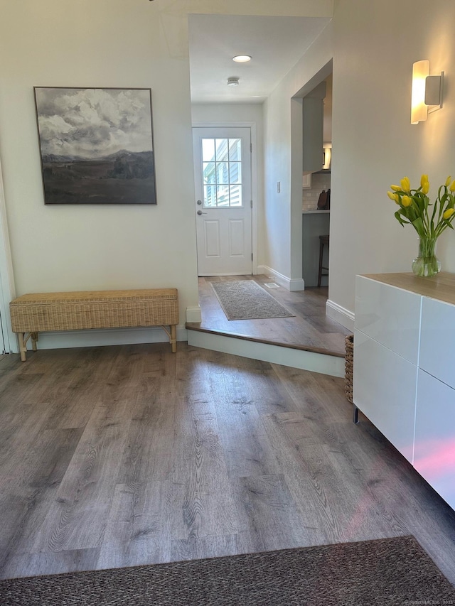 entrance foyer with wood finished floors and baseboards