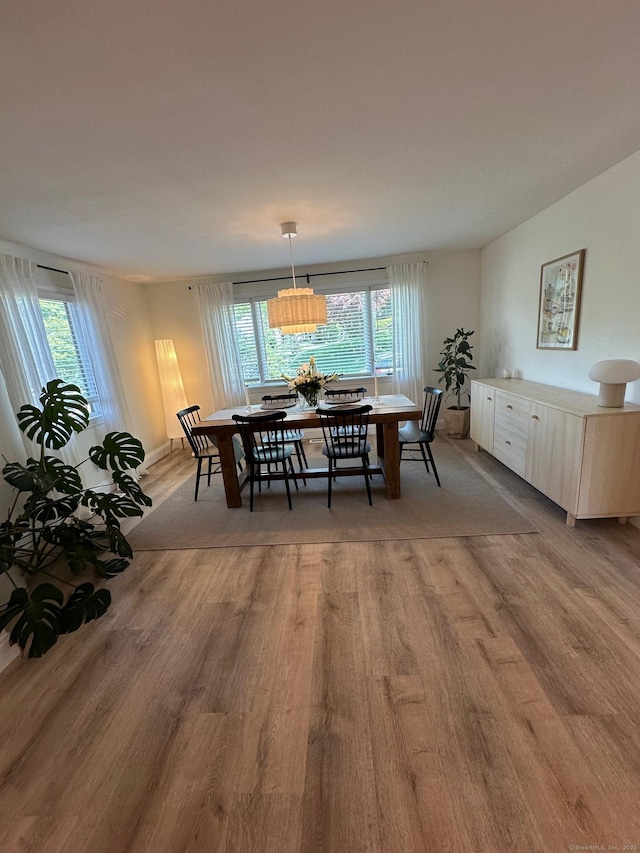 dining area featuring light wood-type flooring