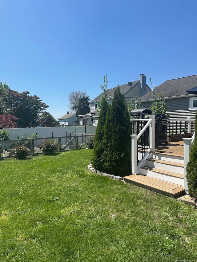 view of yard featuring a wooden deck