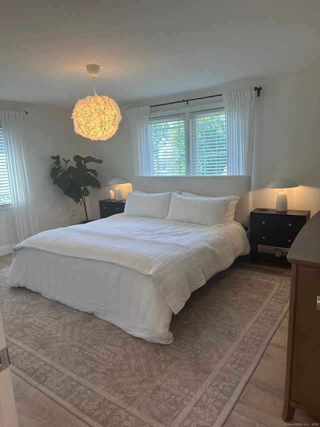 bedroom featuring wood finished floors