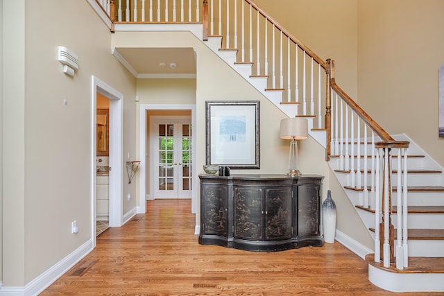34 Avalon Dr, Middlebury, CT 06762 - stairs featuring wood finished floors, crown molding, baseboards, and french doors