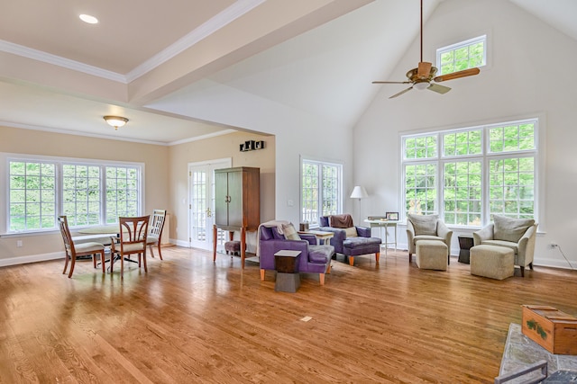 34 Avalon Dr, Middlebury, CT 06762 - living room with high vaulted ceiling, plenty of natural light, light wood-style floors, and baseboards