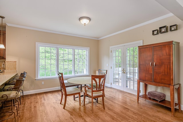 34 Avalon Dr, Middlebury, CT 06762 - dining space featuring light wood finished floors, baseboards, healthy amount of natural light, french doors, and crown molding