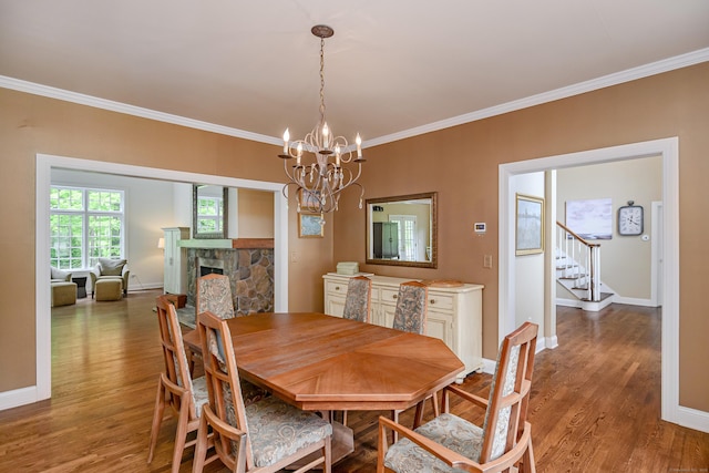 34 Avalon Dr, Middlebury, CT 06762 - dining area featuring crown molding, wood finished floors, baseboards, a chandelier, and stairway