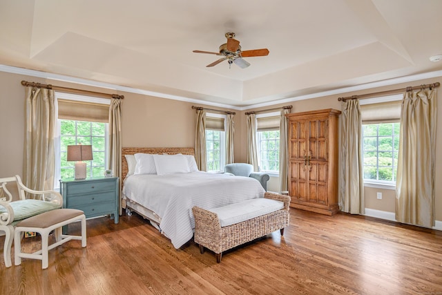 34 Avalon Dr, Middlebury, CT 06762 - bedroom with a tray ceiling, multiple windows, wood finished floors, and a ceiling fan
