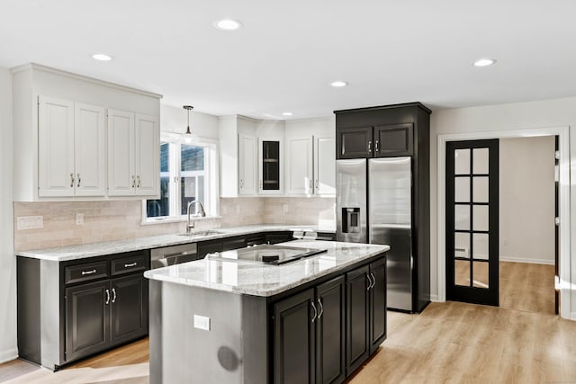 34 Willow Ln, East Lyme, CT 06333 - kitchen with appliances with stainless steel finishes, a sink, dark cabinets, white cabinetry, and recessed lighting