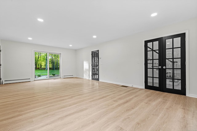 34 Willow Ln, East Lyme, CT 06333 - unfurnished living room with baseboard heating, wood finished floors, french doors, recessed lighting, and baseboards