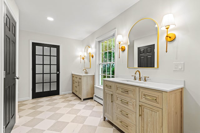 34 Willow Ln, East Lyme, CT 06333 - full bath with baseboard heating, two vanities, tile patterned floors, baseboards, and recessed lighting