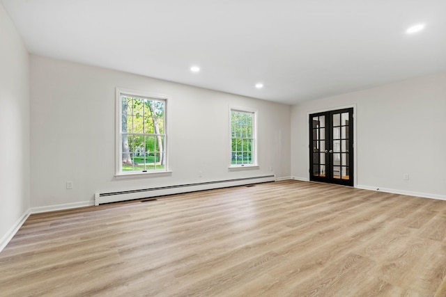 34 Willow Ln, East Lyme, CT 06333 - unfurnished room with a baseboard radiator, light wood-type flooring, french doors, baseboards, and recessed lighting