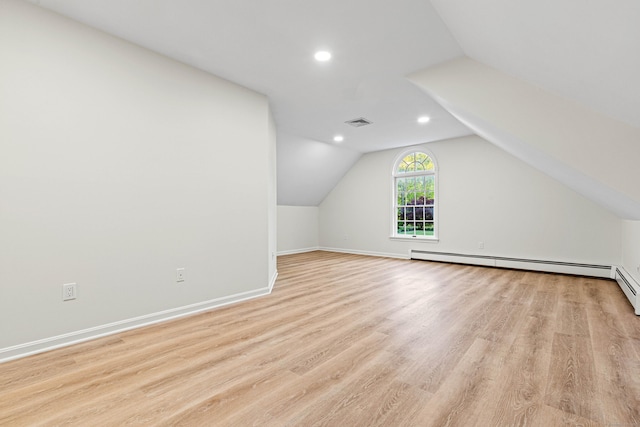 34 Willow Ln, East Lyme, CT 06333 - bonus room with light wood-style floors, baseboards, vaulted ceiling, recessed lighting, and a baseboard heating unit