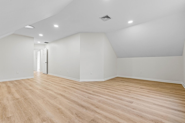 34 Willow Ln, East Lyme, CT 06333 - additional living space featuring light wood-style floors, recessed lighting, vaulted ceiling, and baseboards