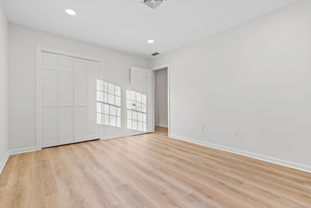 34 Willow Ln, East Lyme, CT 06333 - unfurnished bedroom with light wood-style flooring, baseboards, recessed lighting, and a closet