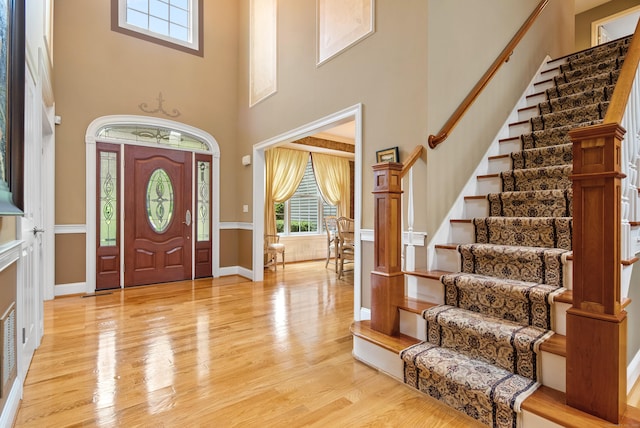 33 Pease Farm Rd, Ellington, CT 06029 - entryway with healthy amount of natural light, a towering ceiling, stairway, and light wood-type flooring