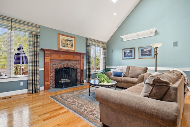 33 Pease Farm Rd, Ellington, CT 06029 - living area featuring high vaulted ceiling, a fireplace, and wood finished floors