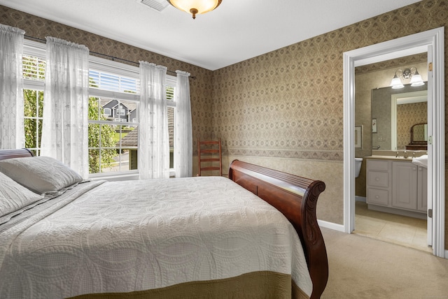 33 Pease Farm Rd, Ellington, CT 06029 - bedroom with light colored carpet, wallpapered walls, and ensuite bathroom