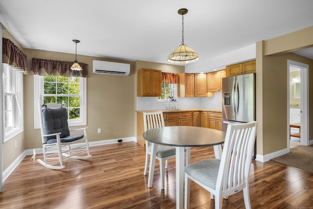 33 Pease Farm Rd, Ellington, CT 06029 - dining space featuring an AC wall unit and wood finished floors