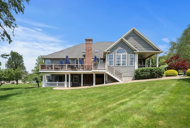 33 Pease Farm Rd, Ellington, CT 06029 - rear view of house featuring a chimney, a lawn, a deck, ceiling fan, and stairway