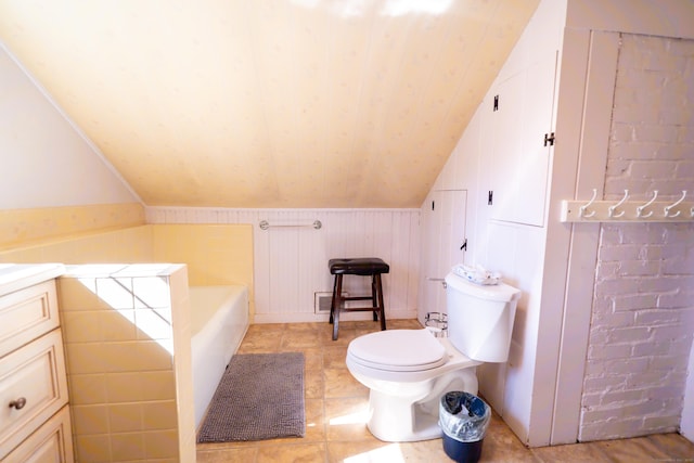 471 Newtown Tpke, Redding, CT 06896 - full bath with lofted ceiling, toilet, a tub to relax in, vanity, and a decorative wall