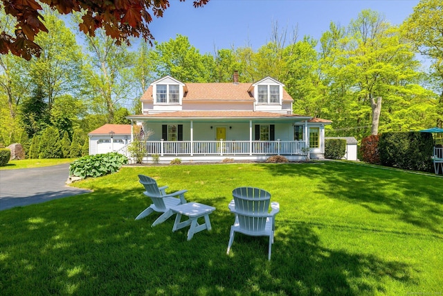 255 Killingly Rd, Pomfret, CT 06259 - view of front facade with covered porch, a front yard, and a chimney