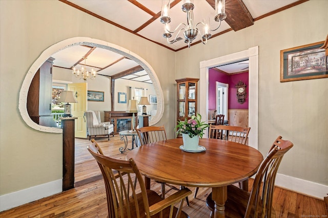 255 Killingly Rd, Pomfret, CT 06259 - dining room with a chandelier, arched walkways, ornamental molding, light wood-style floors, and baseboards