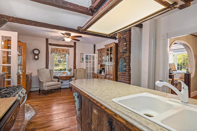 255 Killingly Rd, Pomfret, CT 06259 - kitchen with a sink, baseboard heating, wood finished floors, stainless steel gas range oven, and light countertops