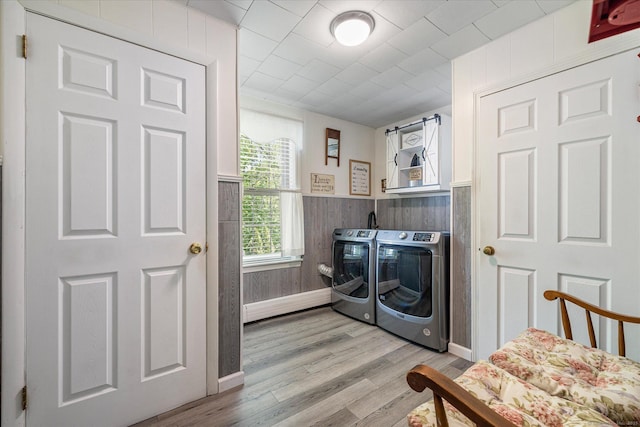 255 Killingly Rd, Pomfret, CT 06259 - laundry room with independent washer and dryer, light wood-style flooring, a wainscoted wall, and wood walls