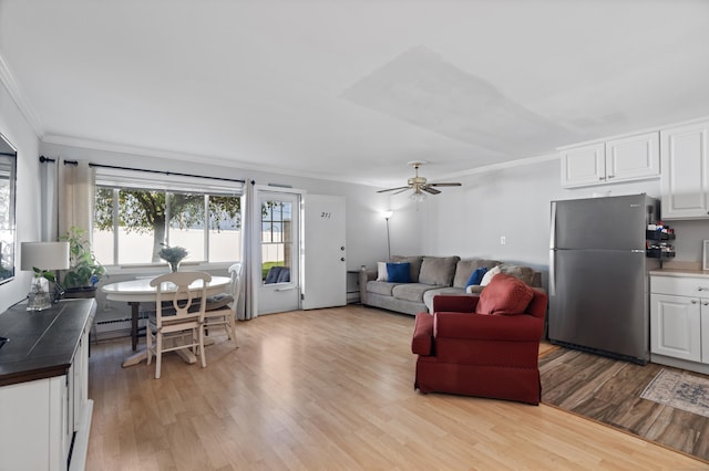 211 W Walk Unit 211, West Haven, CT 06516 - living room featuring crown molding, light wood finished floors, a baseboard radiator, and ceiling fan
