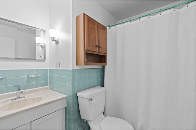 211 W Walk Unit 211, West Haven, CT 06516 - bathroom with tile walls, toilet, vanity, wainscoting, and curtained shower