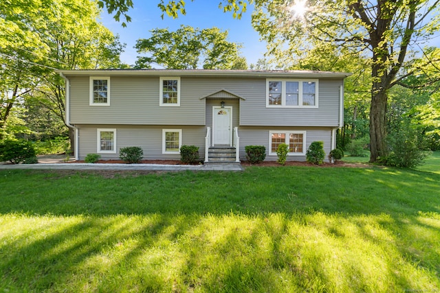 26 Maple Ave, North Haven, CT 06473 - bi-level home featuring entry steps and a front lawn