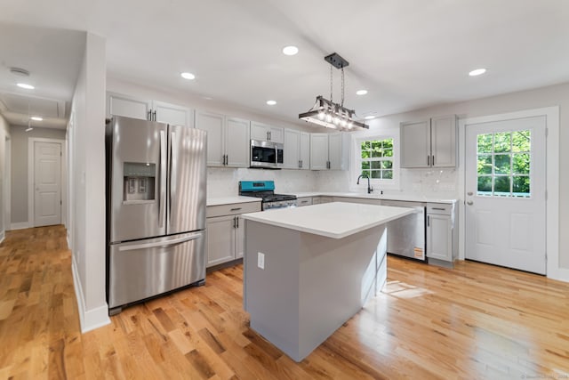 26 Maple Ave, North Haven, CT 06473 - kitchen featuring stainless steel appliances, gray cabinetry, light countertops, backsplash, and recessed lighting