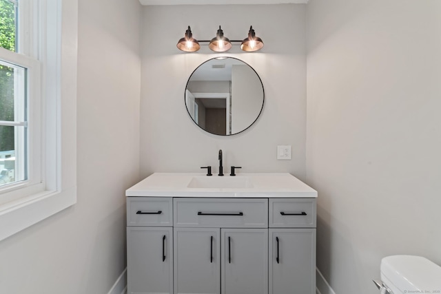 26 Maple Ave, North Haven, CT 06473 - half bath with vanity, toilet, and baseboards