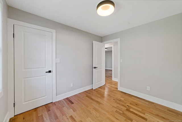 26 Maple Ave, North Haven, CT 06473 - unfurnished bedroom featuring baseboards and light wood-style flooring