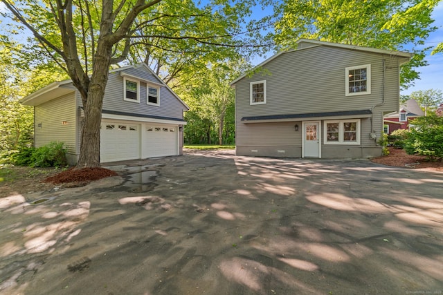 26 Maple Ave, North Haven, CT 06473 - view of front of house with a garage