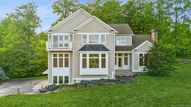 65 Church Rd, Sherman, CT 06784 - rear view of property featuring a balcony, a chimney, a lawn, and a shingled roof
