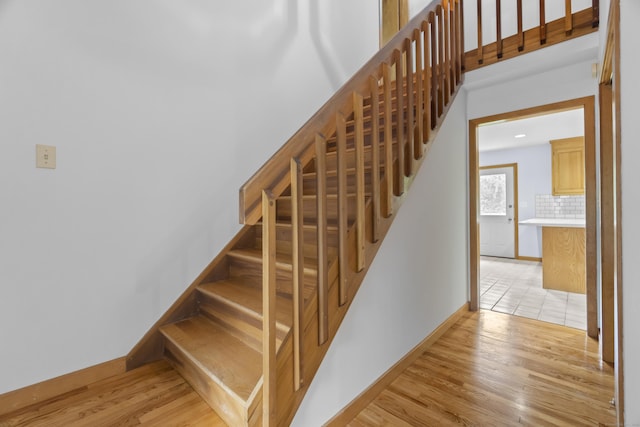 2 Meadowview Ln, Norwich, CT 06360 - stairway with wood finished floors and baseboards