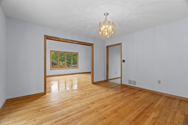 2 Meadowview Ln, Norwich, CT 06360 - unfurnished room with a chandelier, light wood-type flooring, and baseboards