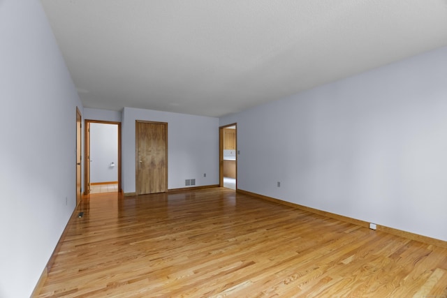 2 Meadowview Ln, Norwich, CT 06360 - empty room featuring light wood finished floors and baseboards