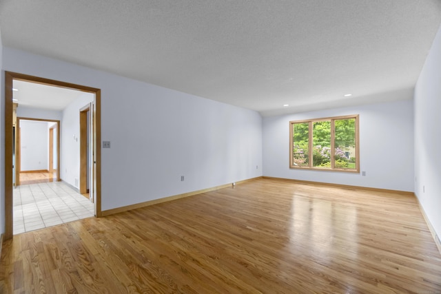 2 Meadowview Ln, Norwich, CT 06360 - empty room with light wood-type flooring and baseboards