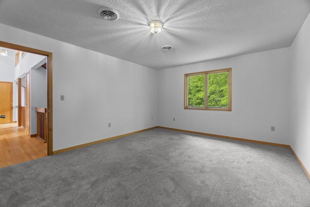 2 Meadowview Ln, Norwich, CT 06360 - carpeted empty room featuring baseboards and a textured ceiling