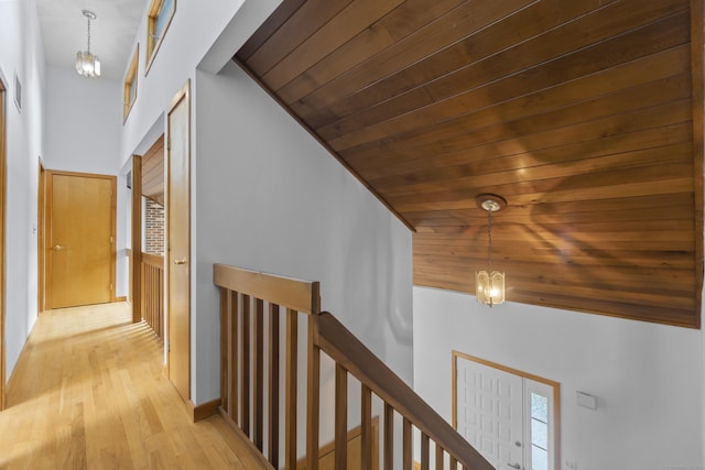 2 Meadowview Ln, Norwich, CT 06360 - hall with an upstairs landing, a chandelier, light wood-style flooring, and wooden ceiling