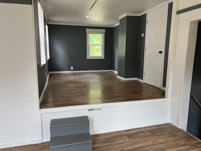24 New St, Seymour, CT 06483 - empty room with wood finished floors, crown molding, baseboards, recessed lighting, and attic access